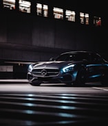 black porsche 911 parked on parking lot