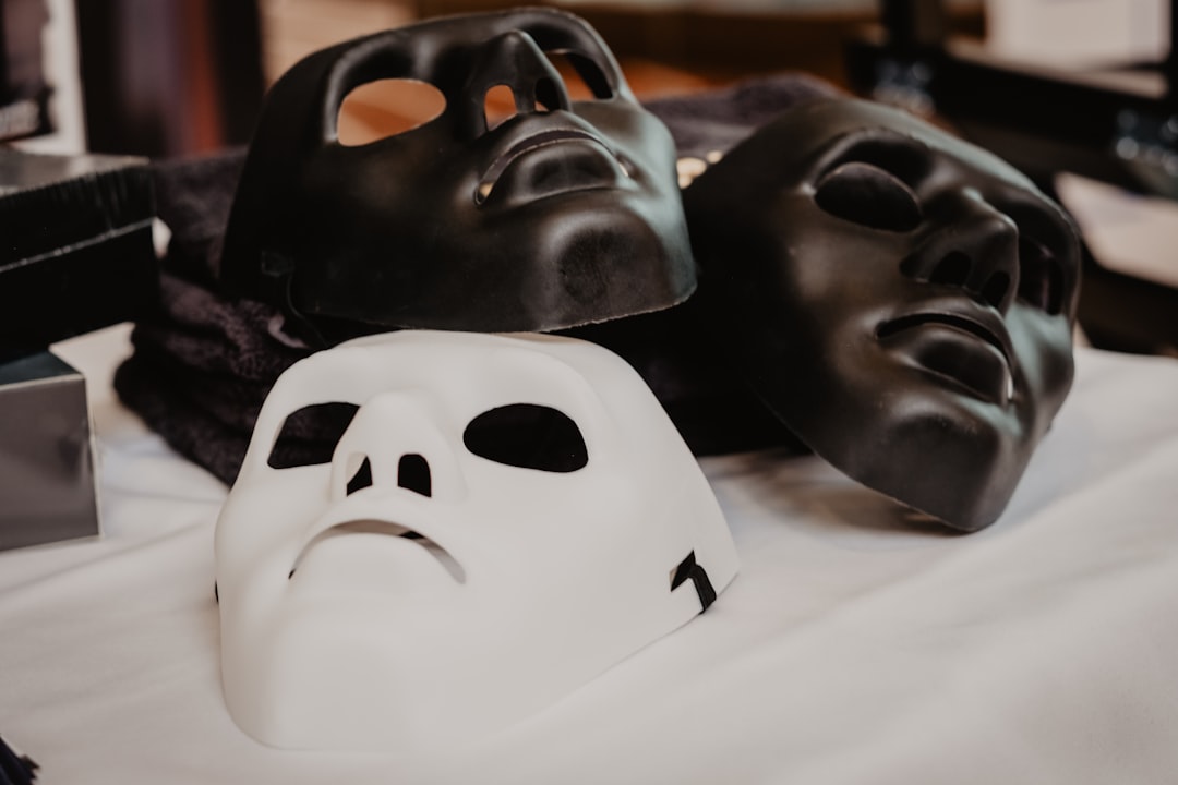 white and black mask on white textile