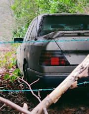 gray car on green grass field during daytime
