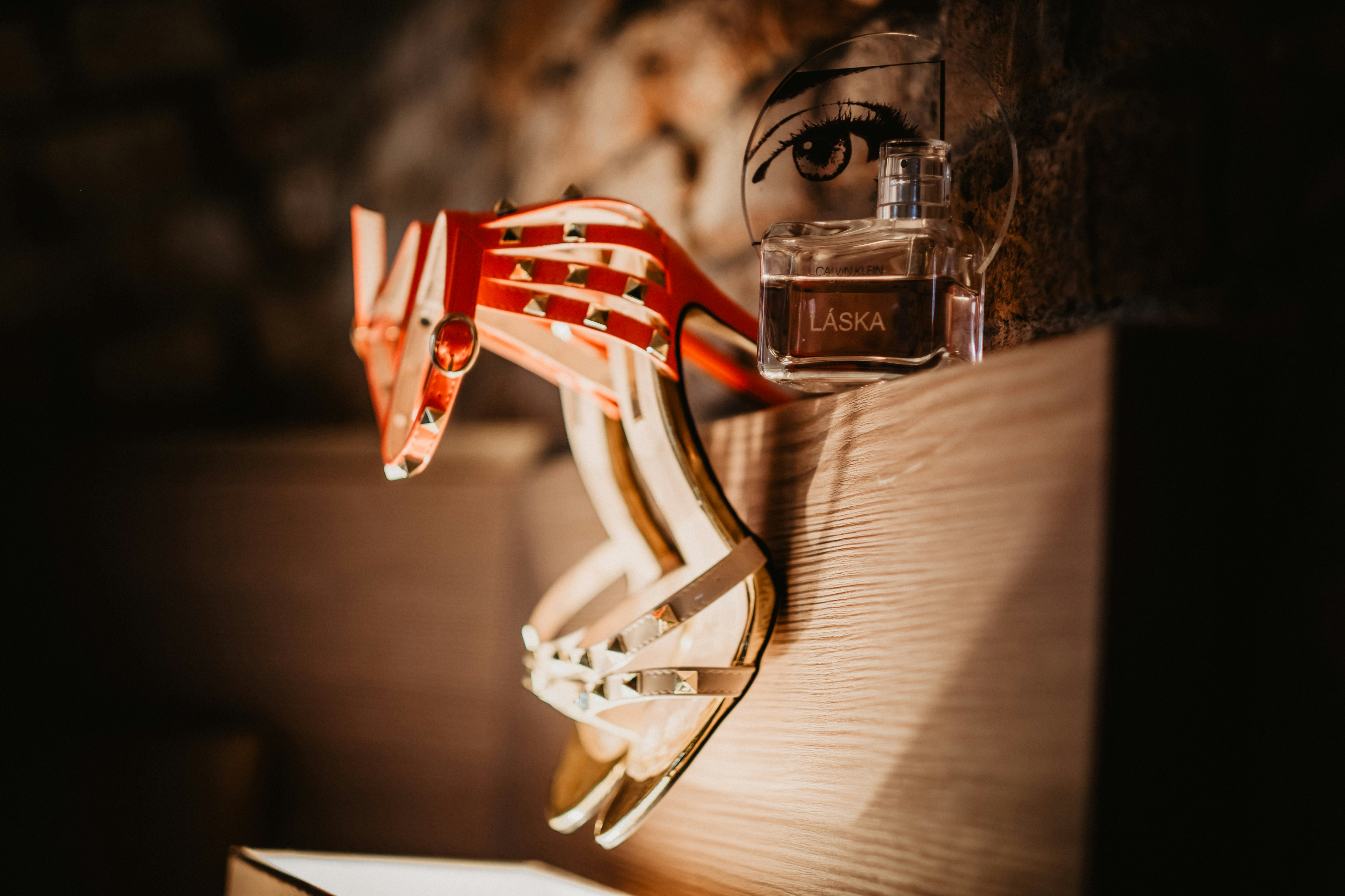 gold and red trophy on brown wooden table