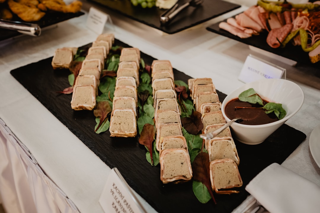 brown and green food on black tray