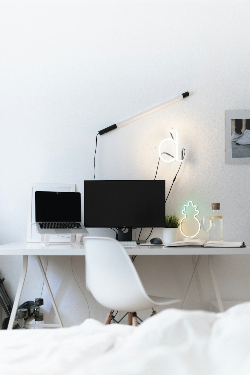 black flat screen computer monitor on white table