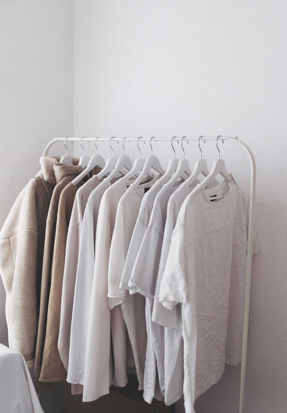 white long sleeve shirt on white clothes hanger