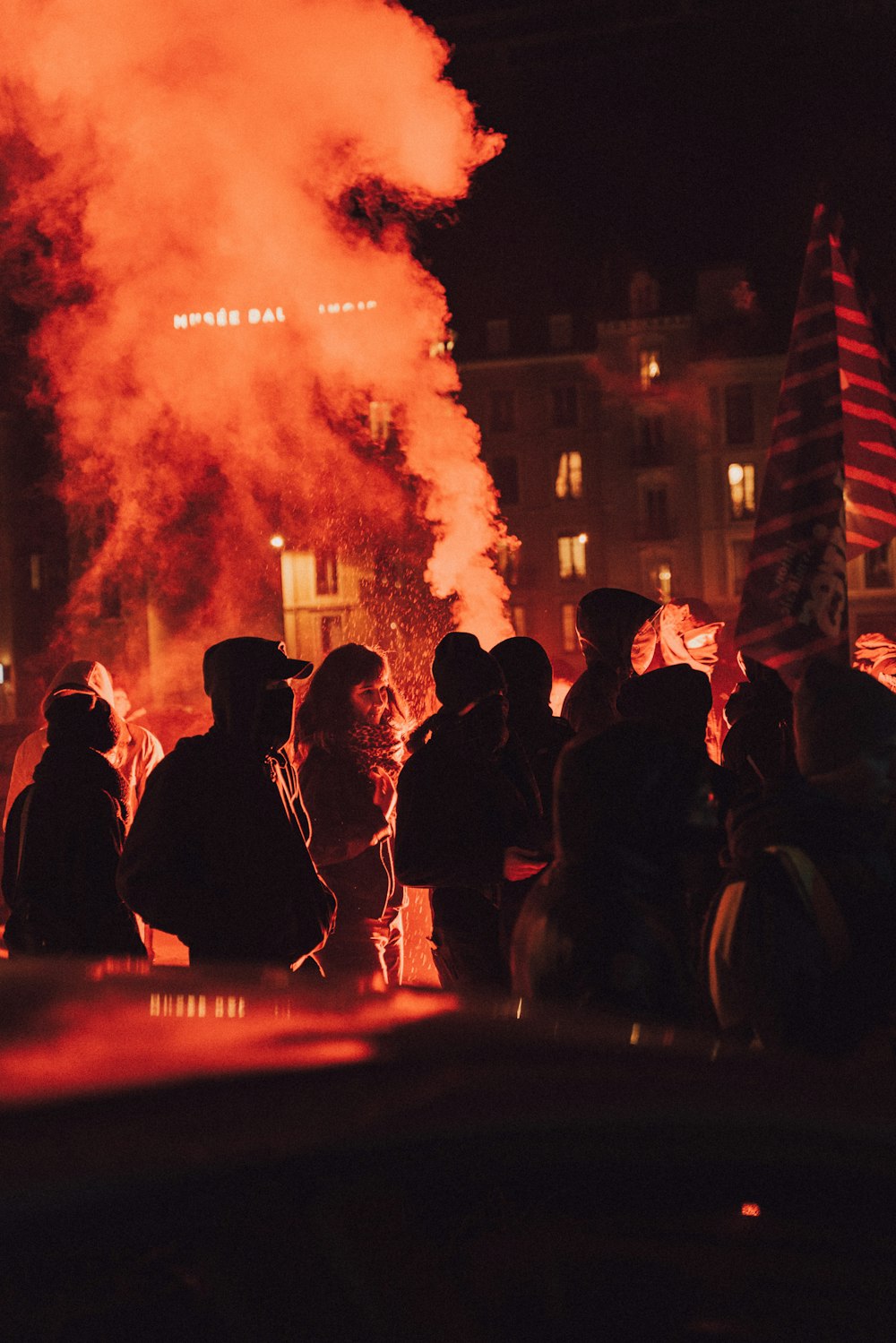 people gathering in front of fire