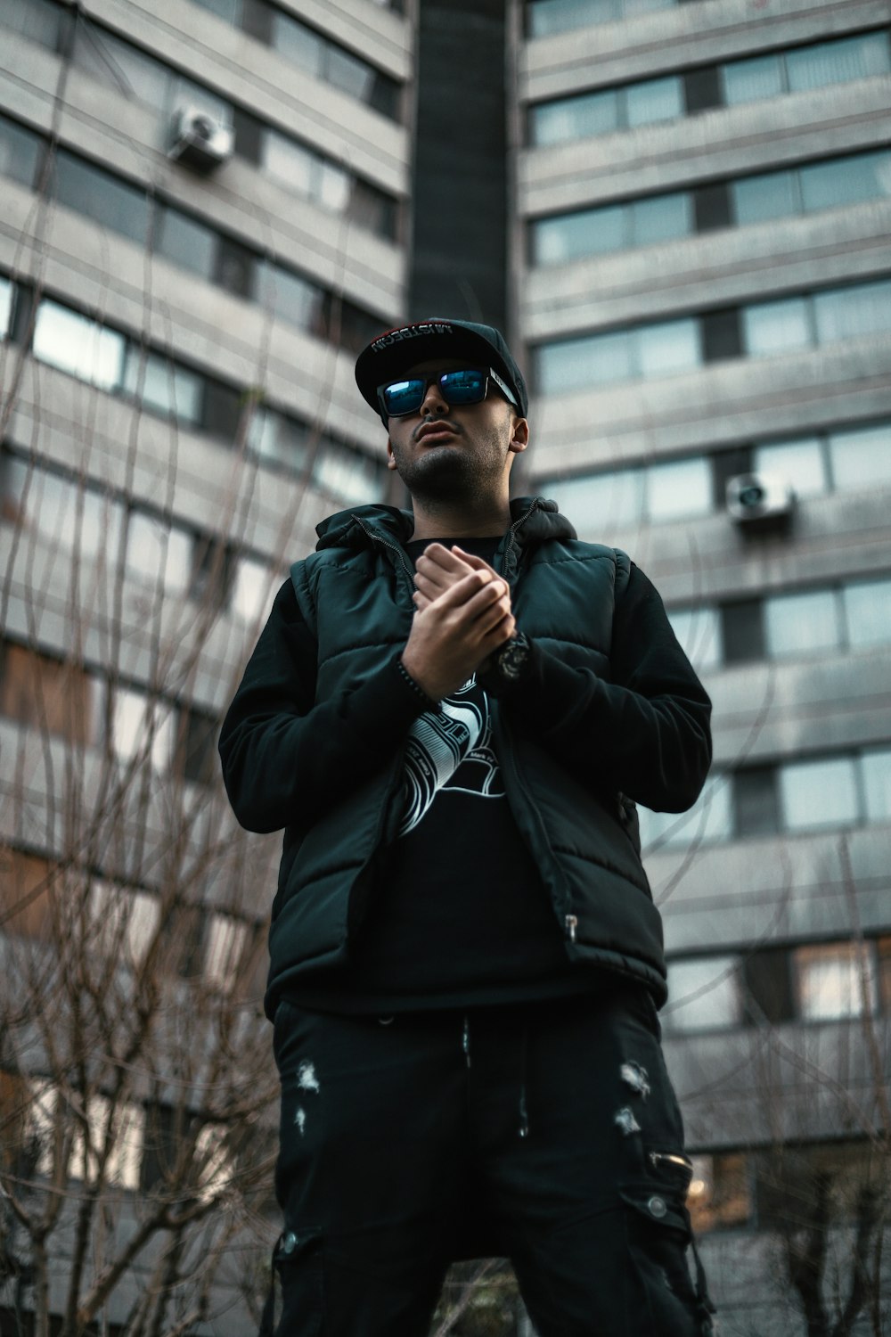 man in black jacket wearing black sunglasses