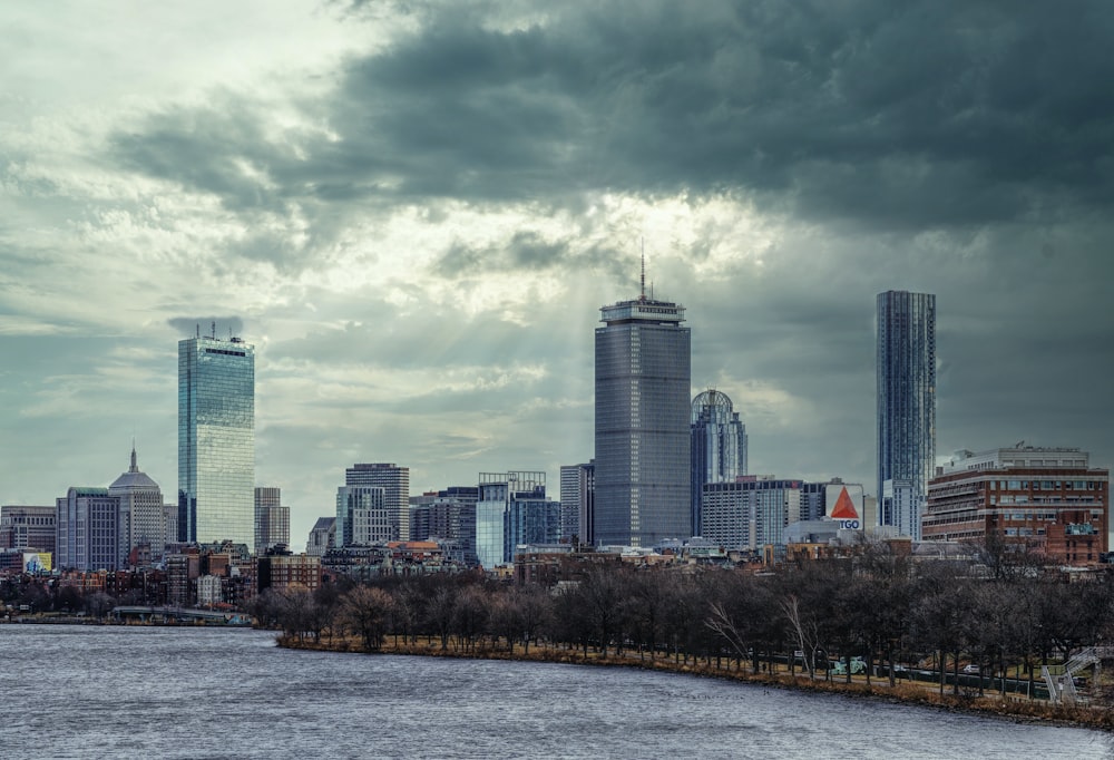 city skyline under cloudy sky during daytime