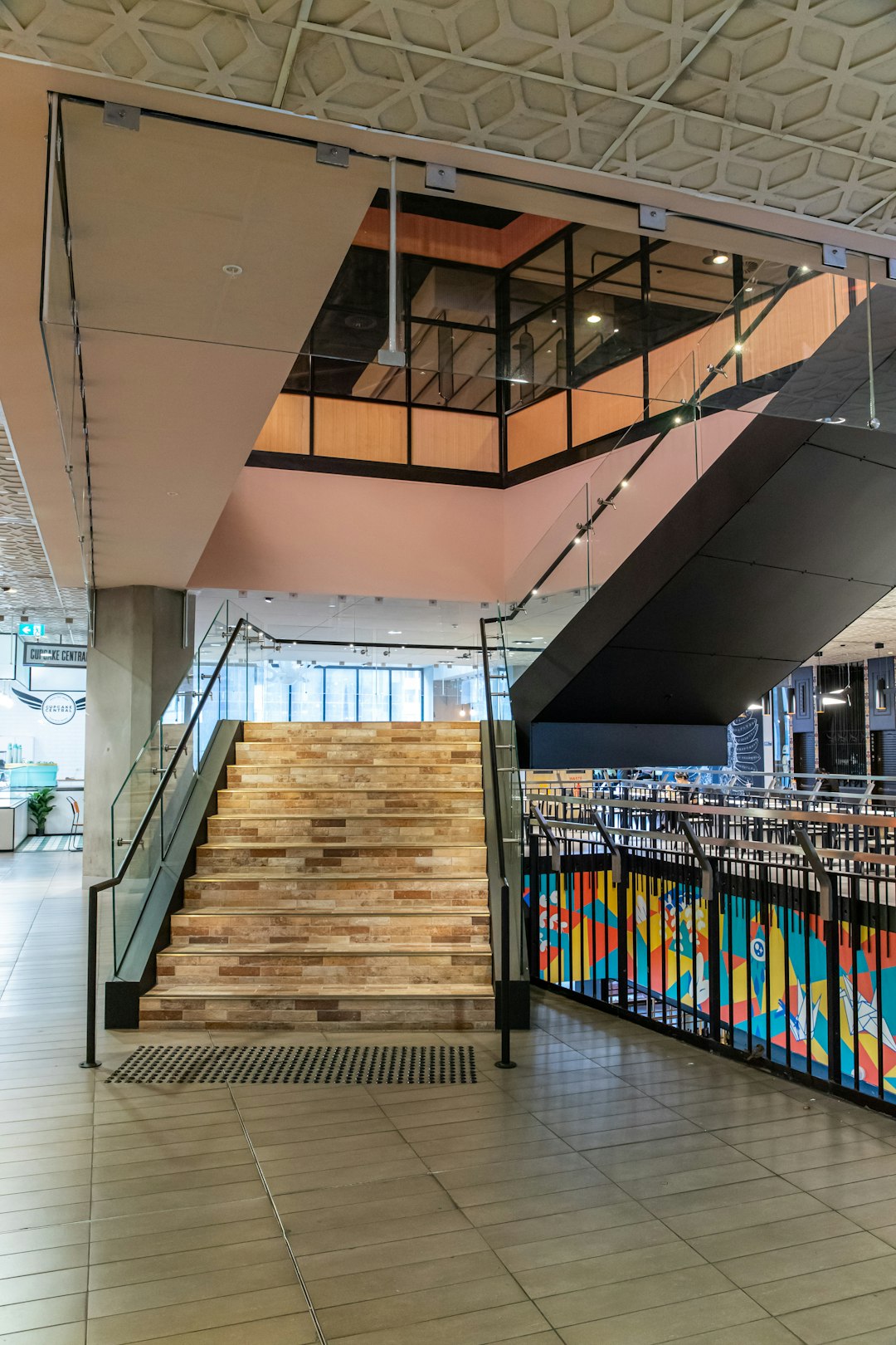 brown wooden stairs with brown wooden railings