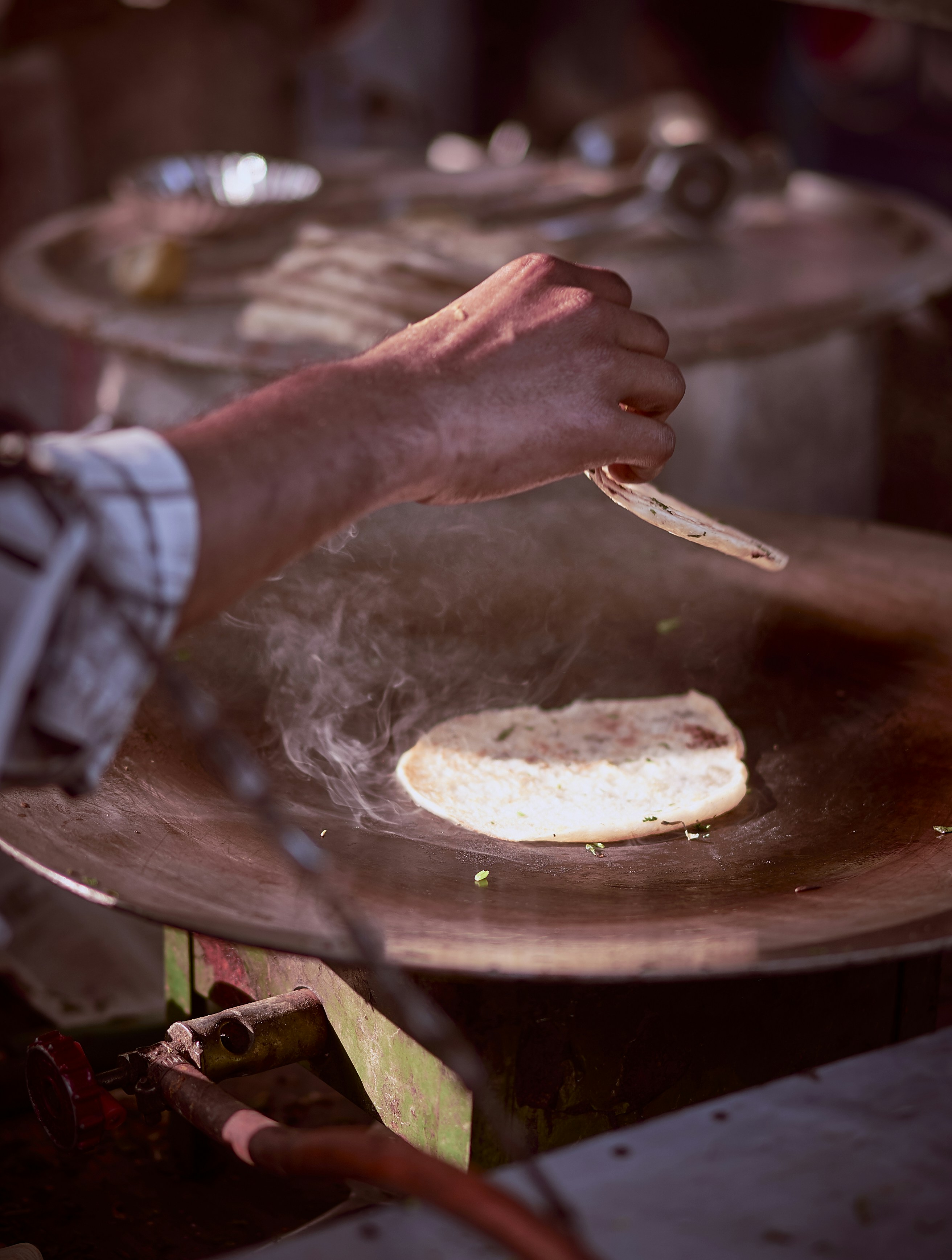 Kulcha being cooked by a roadside food vendor