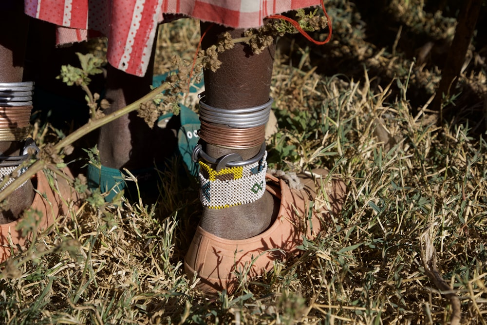 person wearing brown leather boots