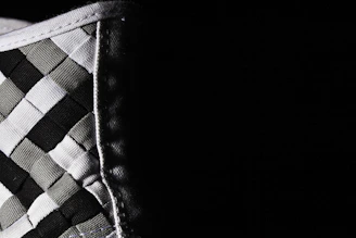 Close-up of a pastel checkered tablecloth showcasing fine stitching and durable fabric texture