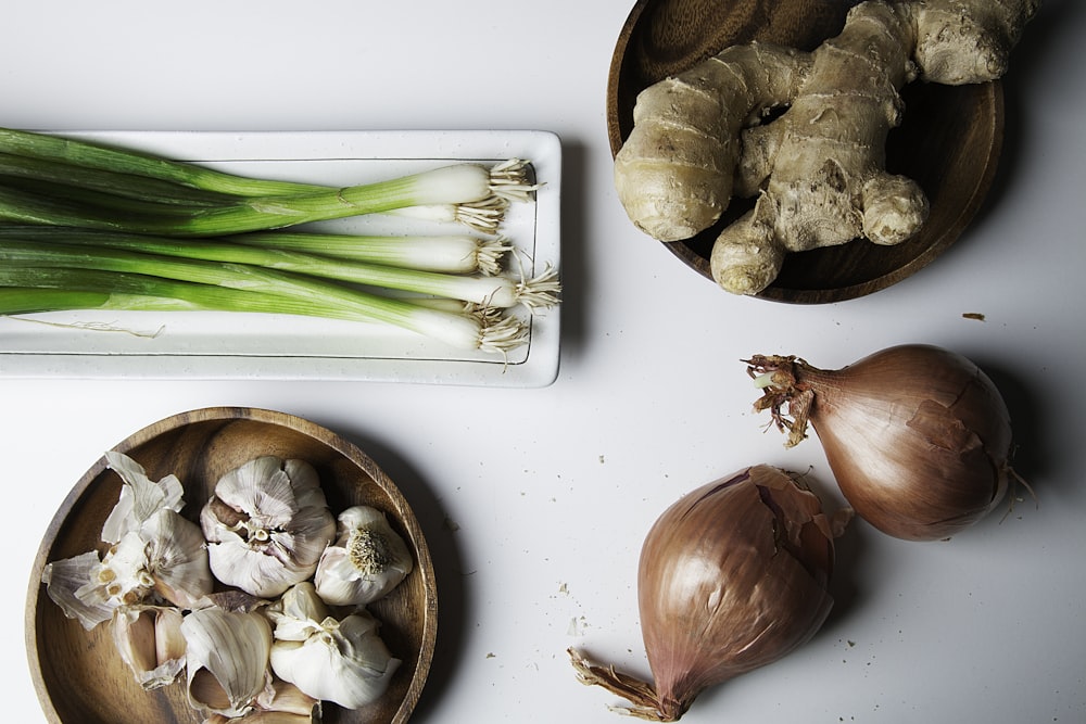 brown garlic on white chopping board