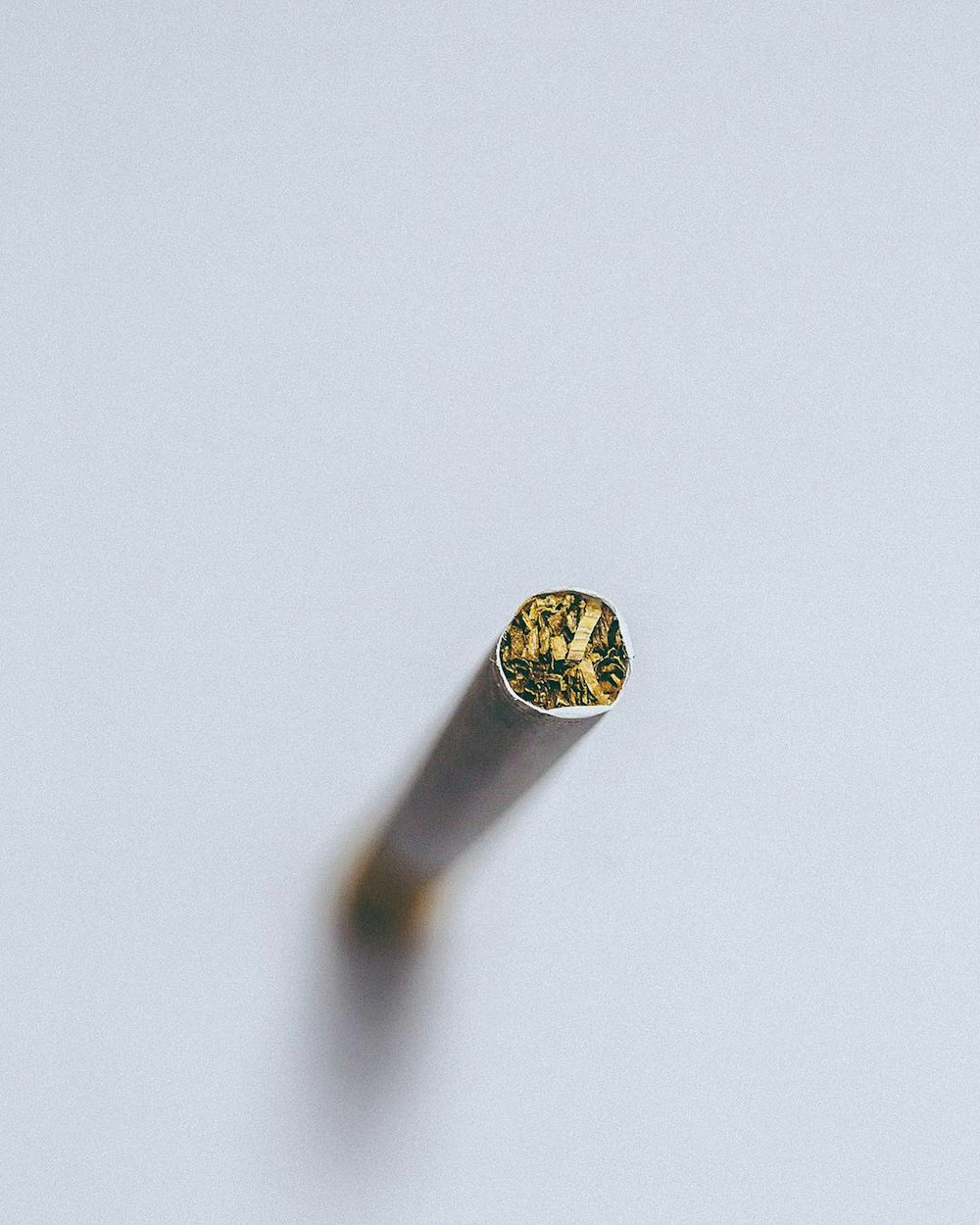 silver diamond ring on white surface