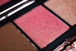 A close-up of a luxurious eye shade palette.