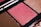 Close-up of a halal makeup palette featuring warm nude and rose shades with a smooth, matte finish.