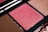 Close-up of a halal makeup palette featuring warm nude and rose shades with a smooth, matte finish.