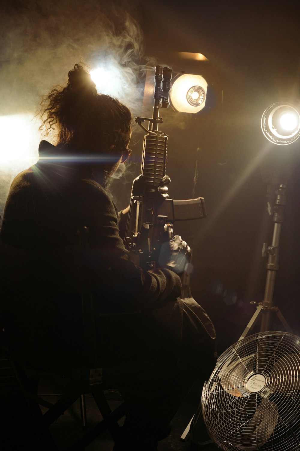 silhouette of 2 men standing in front of microphone