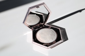 black eyeshadow palette on white table