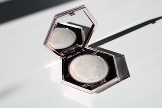 black eyeshadow palette on white table