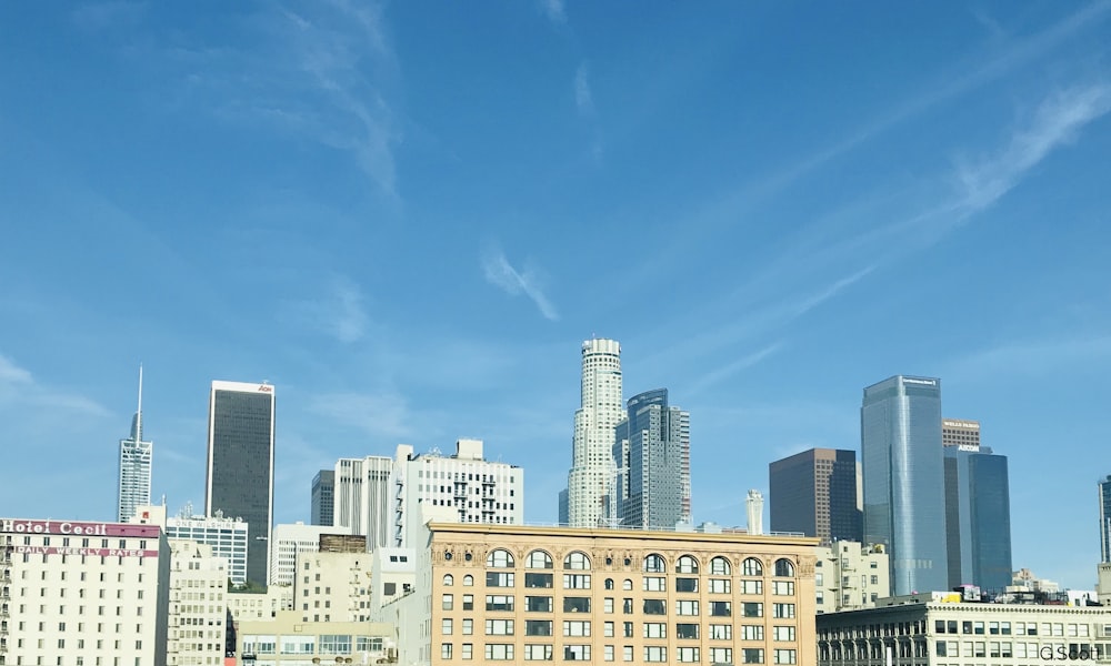 white and brown concrete building under blue sky during daytime