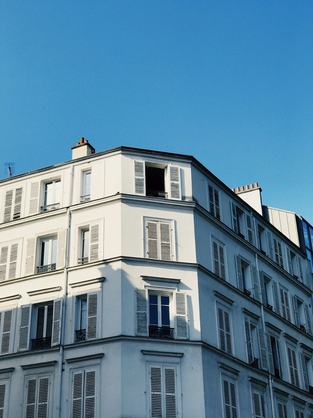 white concrete building under blue sky during daytime