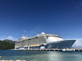 white cruise ship on sea under blue sky during daytime