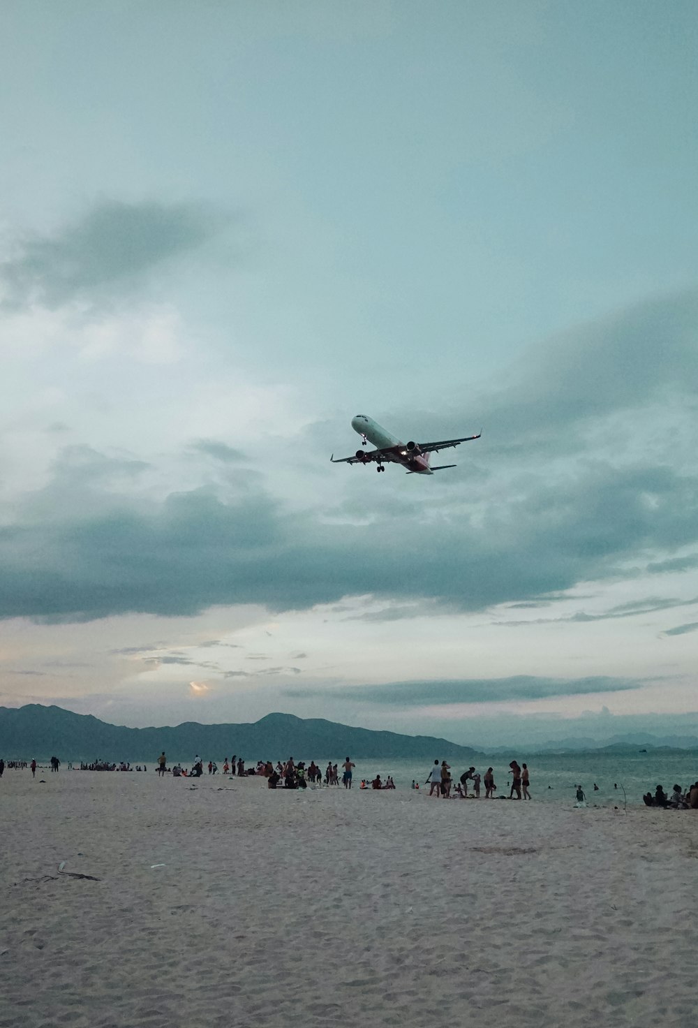 people walking on beach during daytime