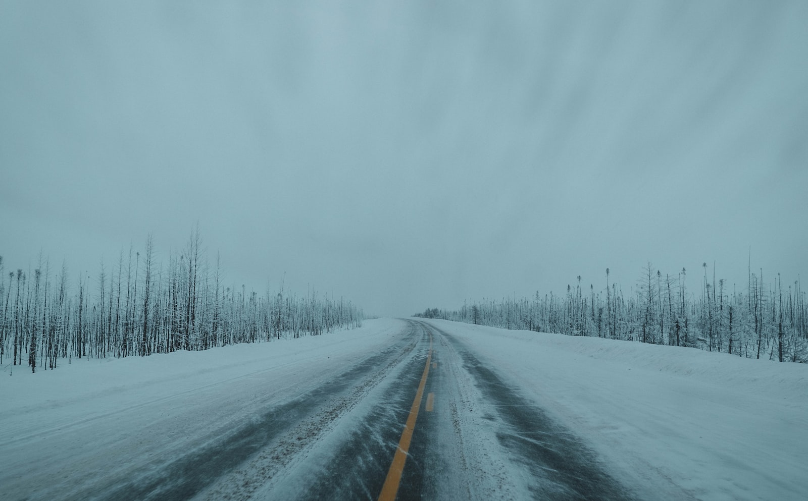 Fujifilm X-T10 + Fujifilm XF 10-24mm F4 R OIS sample photo. Black asphalt road covered photography