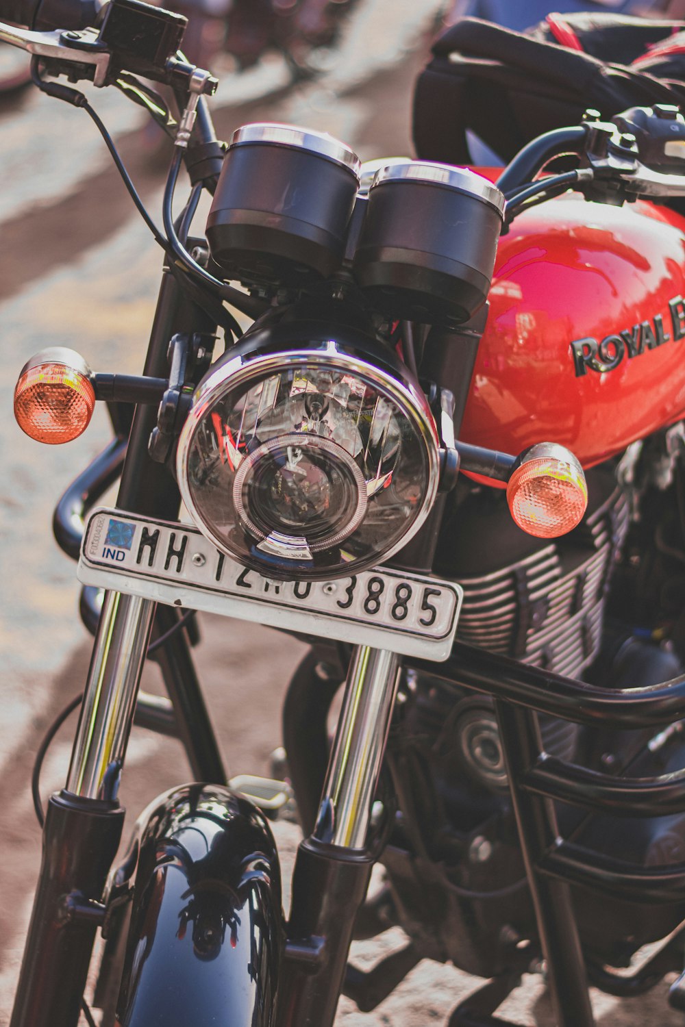 red and black motorcycle near red motorcycle