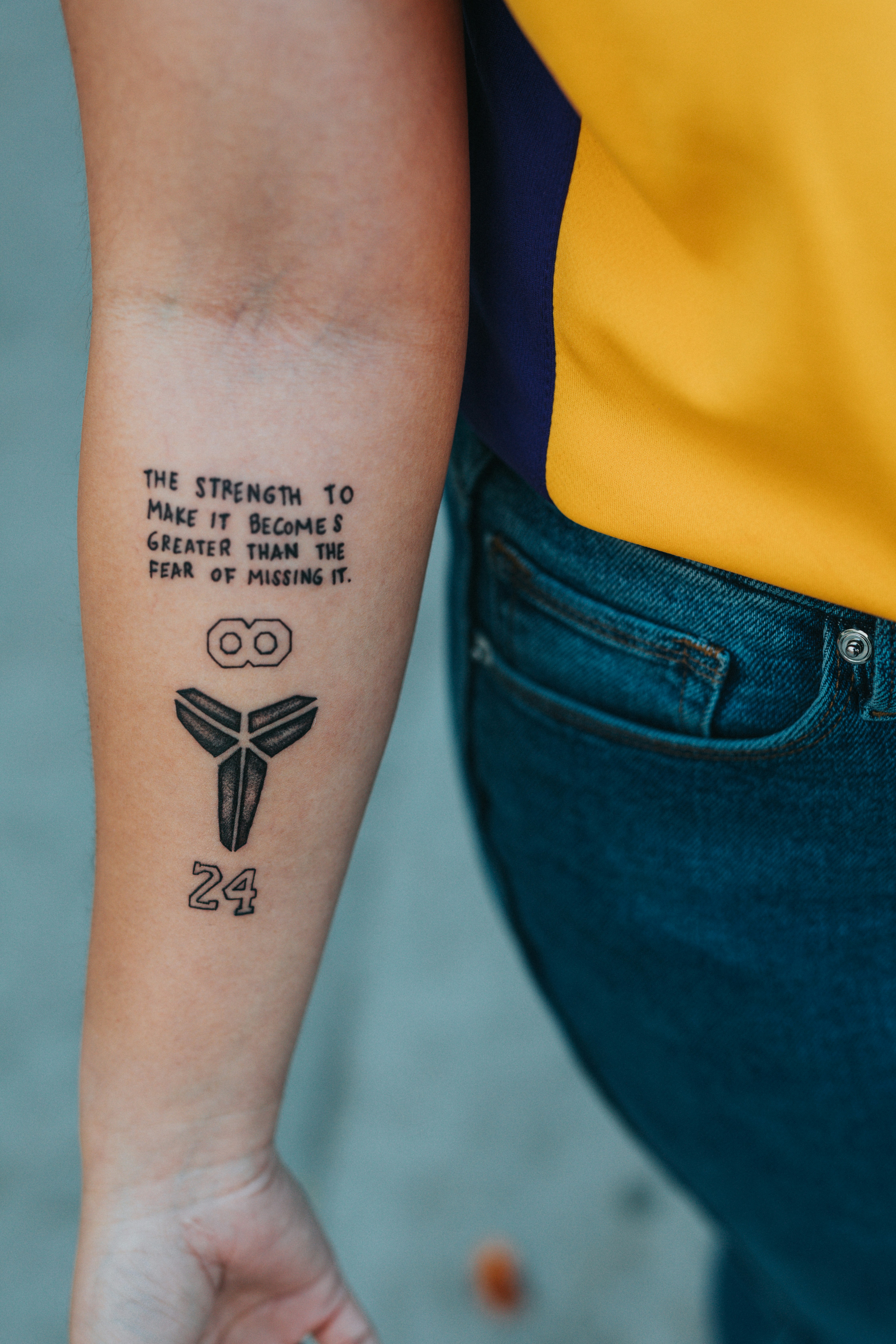 Person With Black Kanji Text Tattoo On Right Arm Photo Free Skin Image On Unsplash