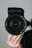 black nikon dslr camera on persons hand