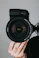 black nikon dslr camera on persons hand