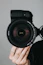 black nikon dslr camera on persons hand