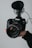 A satisfied customer holding camera equipment rented from Sahasra Sree Creations.