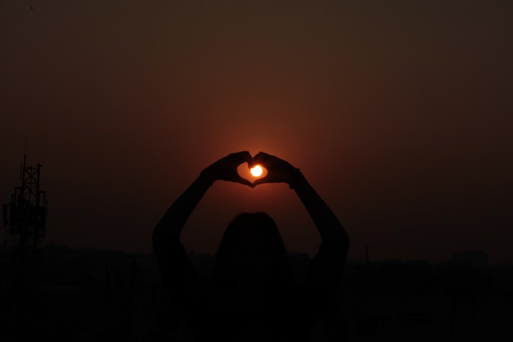 person holding lighted candle during night time