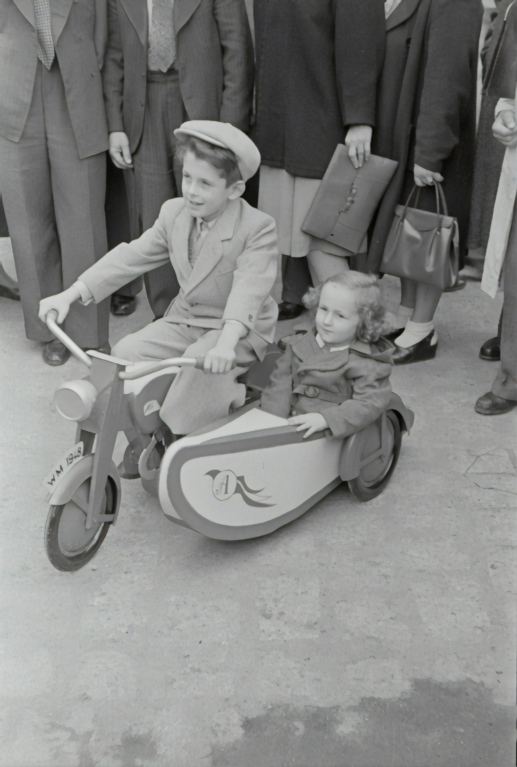 	Little boy with sidecar machine.1948