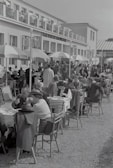 An outdoor seating area filled with guests.