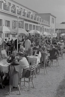 An outdoor dining area filled with happy customers enjoying their meals.