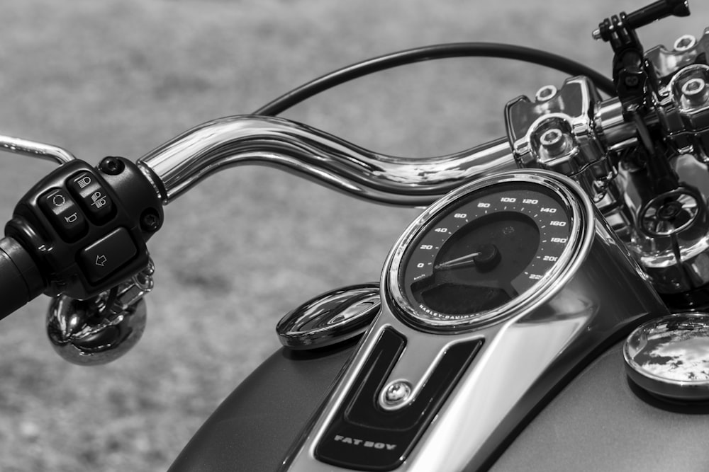 grayscale photo of car steering wheel