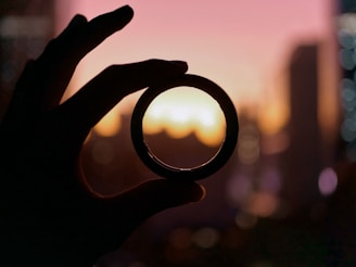 person holding round black frame