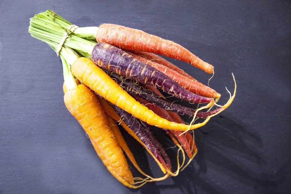 orange carrots on black textile