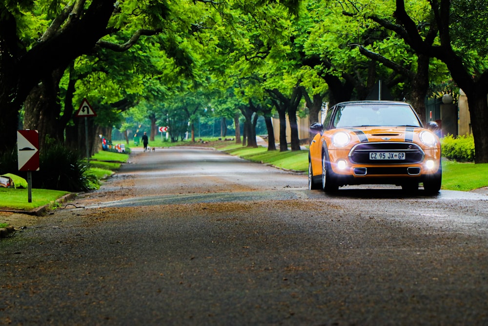 yellow car on road during daytime