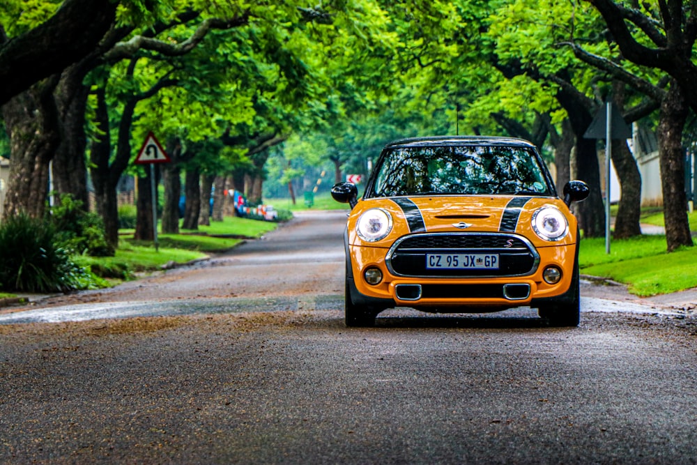 yellow and black mini cooper on road during daytime