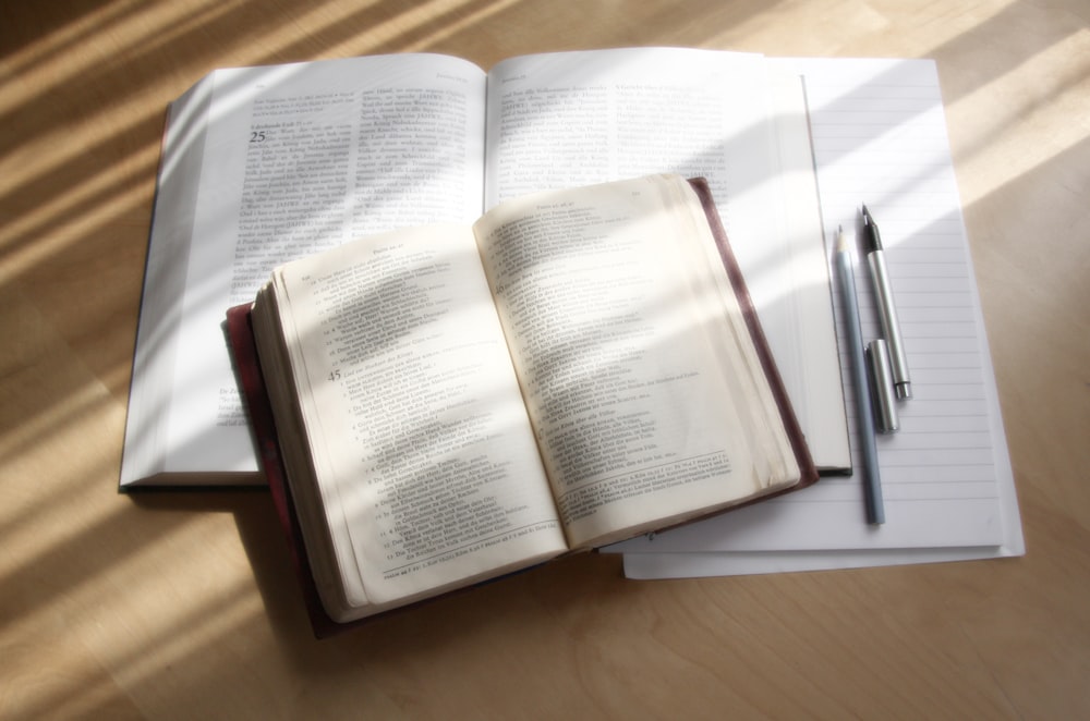 white book page on brown wooden table