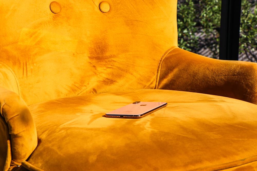 white tablet computer on yellow textile