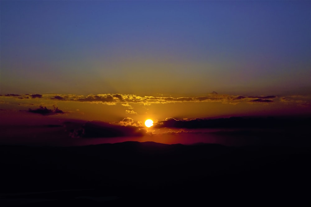 silhouette of mountain during sunset