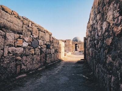 gray concrete building under blue sky during daytime jordan teams background