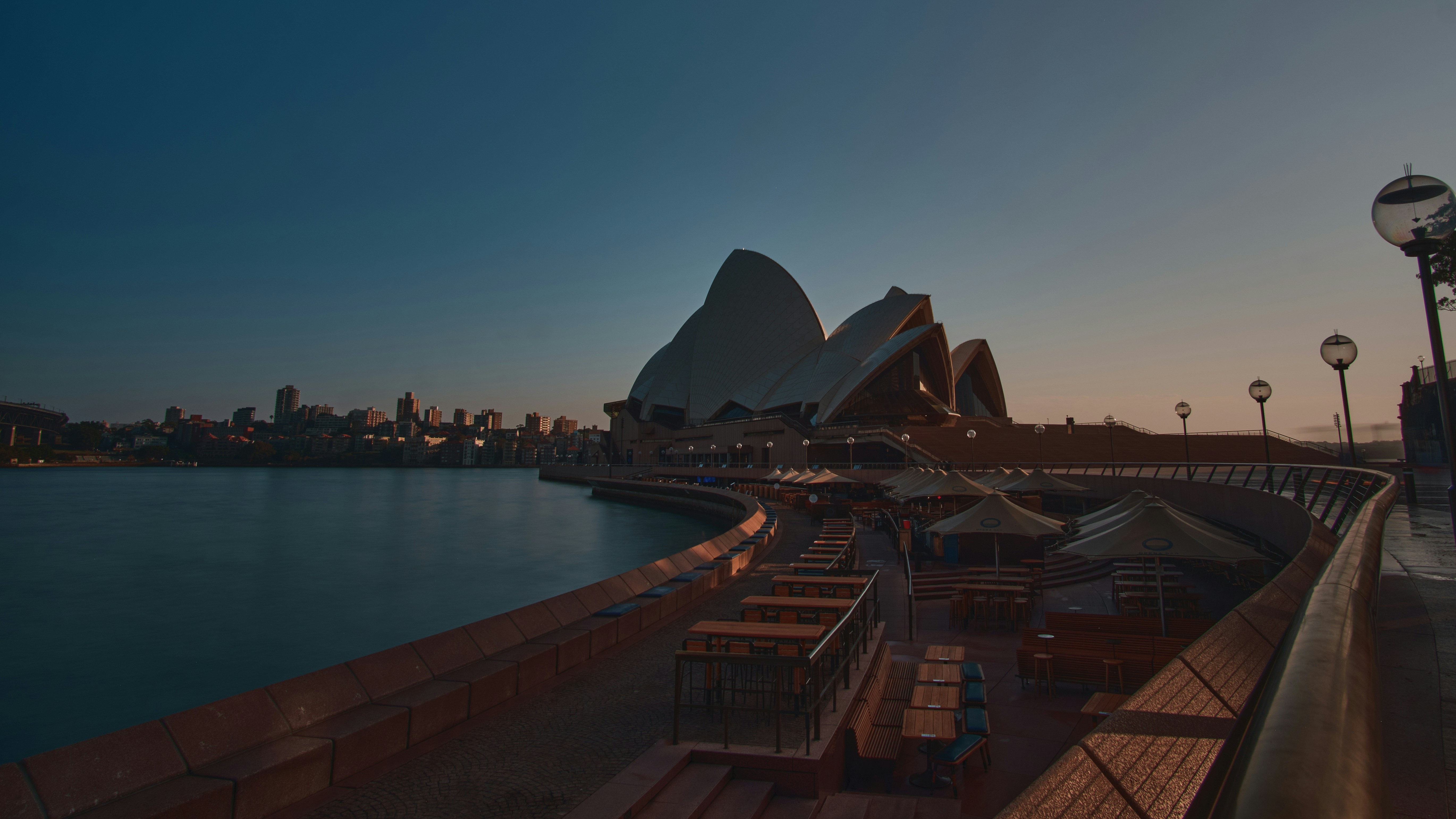 brown and white building near body of water during daytime