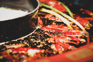 A vibrant close-up of a sizzling chili pepper dish with steam rising, capturing the essence of bold flavors.