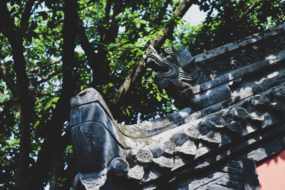 black concrete dragon statue on roof