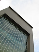 An exterior view of a contemporary building with large windows.